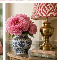 Brass lamp, blue-and-white vase and pink flowers