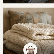 Stacked neutral knit blankets